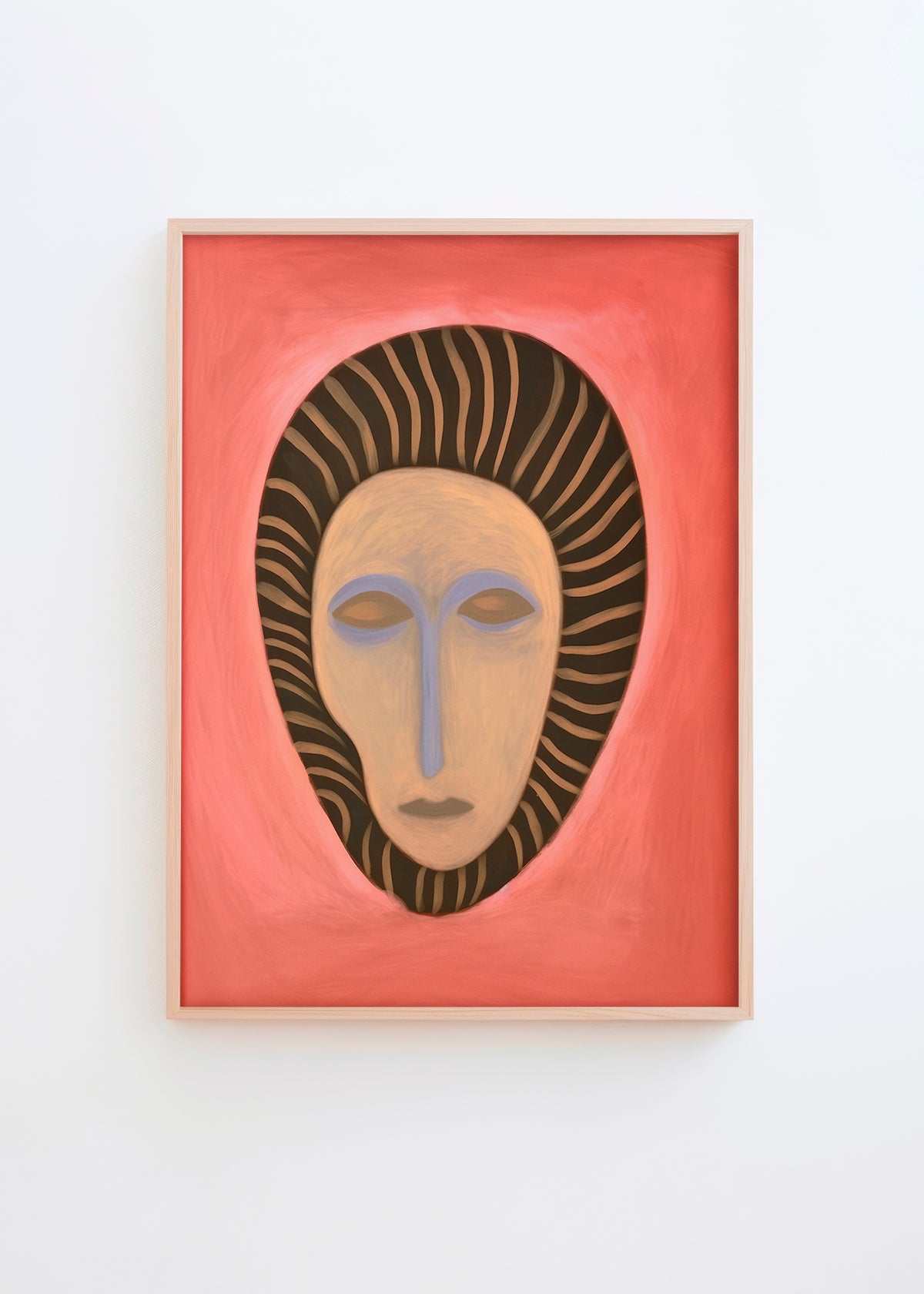 Poster of an abstract tribal-inspired mask with coral red background and striped hair-like design, framed in light wood.