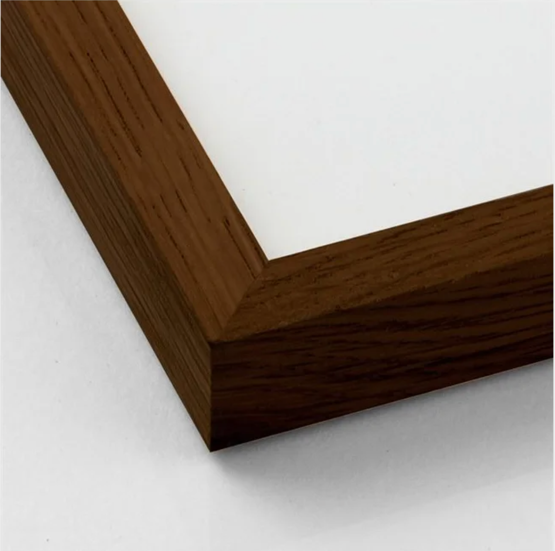 Close-up of dark oak wooden frame corner showing texture and grain pattern