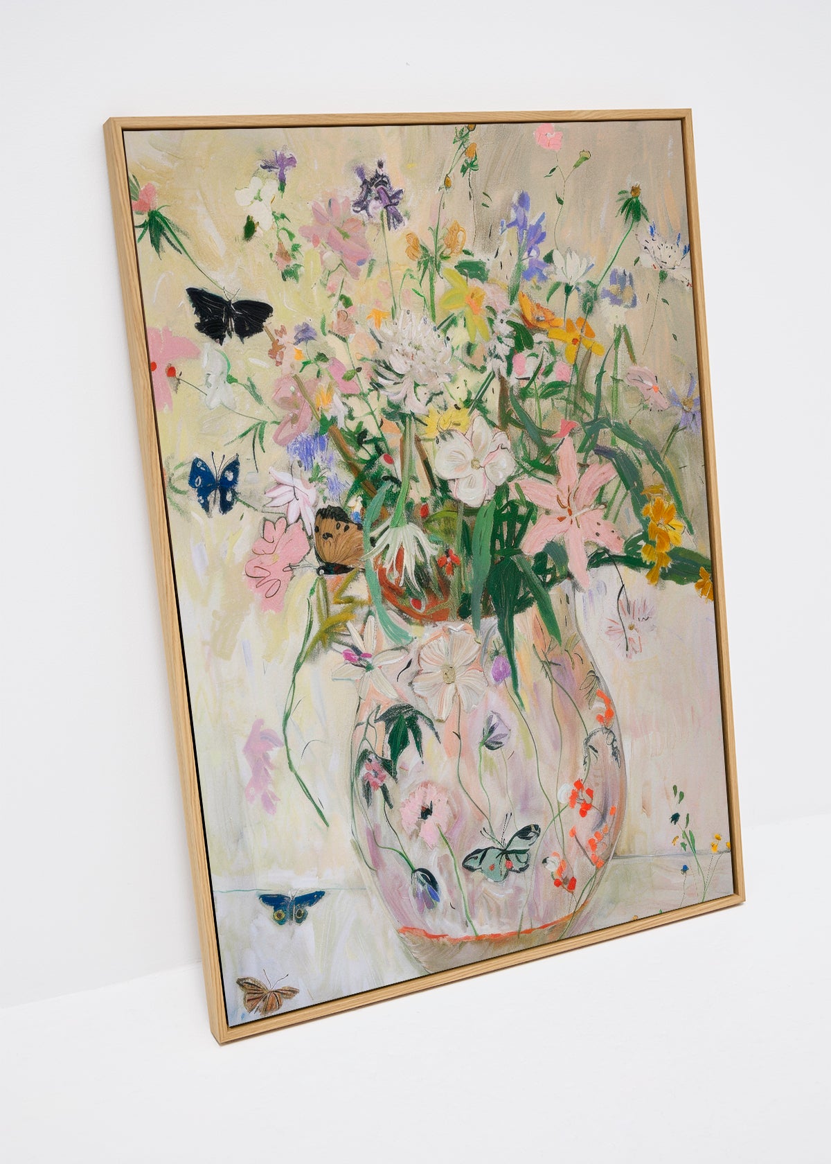 Wild Garden canvas print with colorful wildflowers and butterflies in a soft pastel vase, shown in wooden frame