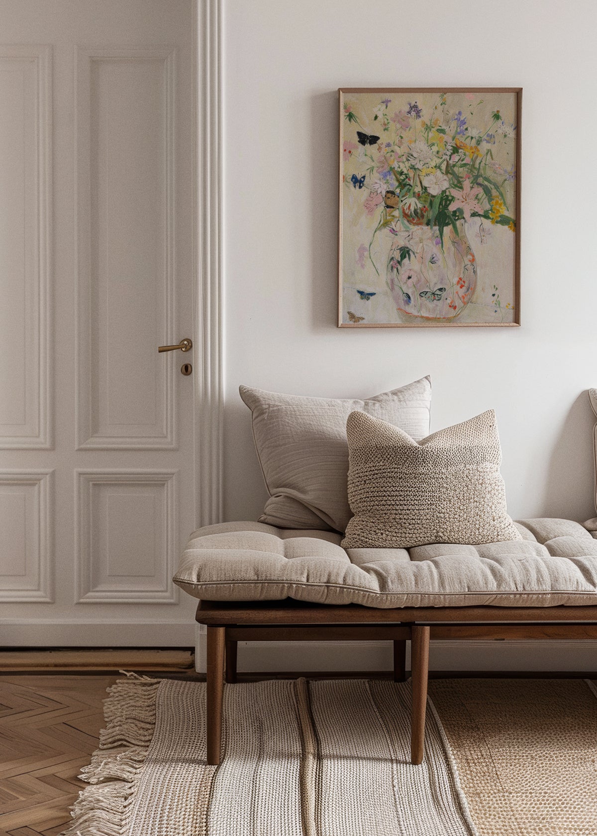 Delicate floral poster titled "Wild Garden" in soft pastels, styled in a bright, Nordic-inspired living room with neutral tones and natural textures.