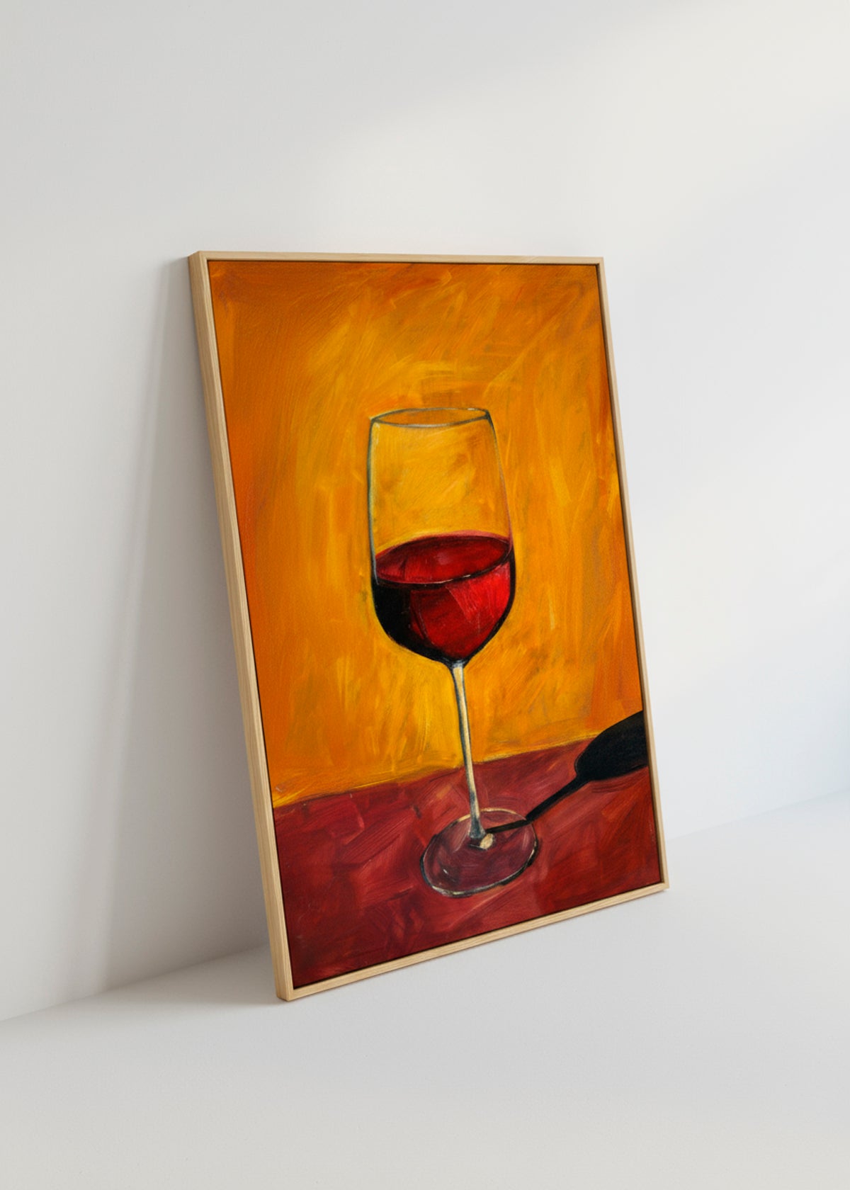 Close-up of the red wine glass canvas leaning against a white wall in natural sunlight.