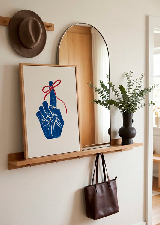 Remember poster styled in a Scandinavian entryway with mirror and wooden details
