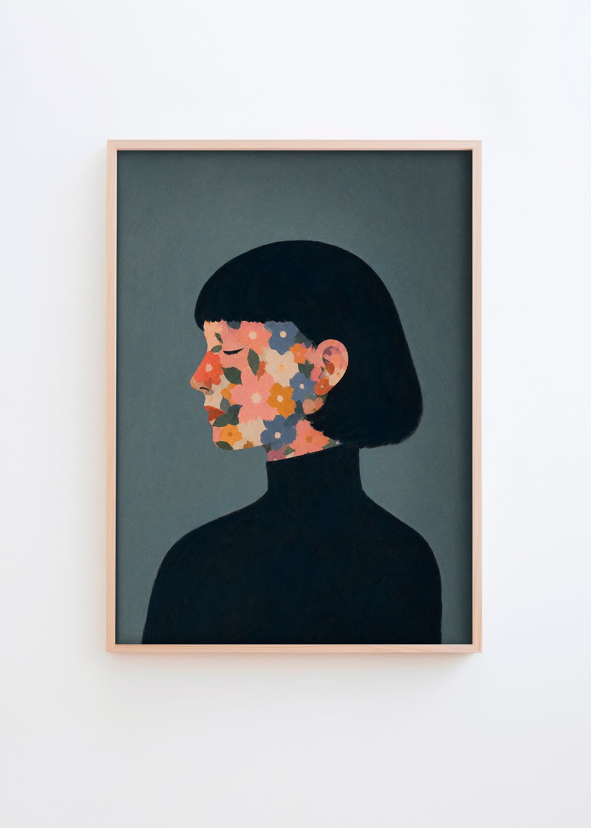 A Face I Once Knew poster featuring a woman’s profile with colorful flowers in muted pink, orange, blue and green tones on a dark blue-grey background, framed in light oak for a modern Scandinavian look.