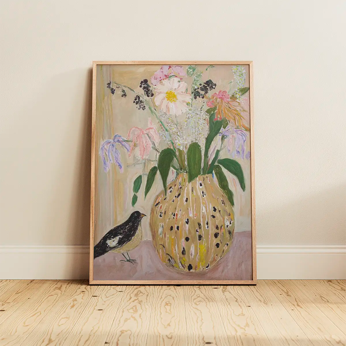 The ‘Bird No. 2’ poster in an oak frame leaning against a white wall, showcasing a soft botanical bird illustration in pastel tones.