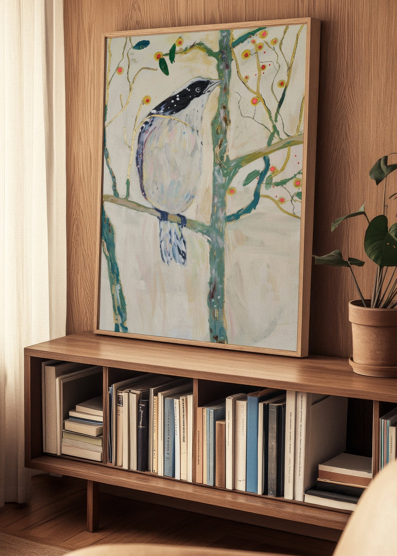 Framed Bird no. 3 poster displayed on a wooden bookshelf in a cozy Nordic living room setting