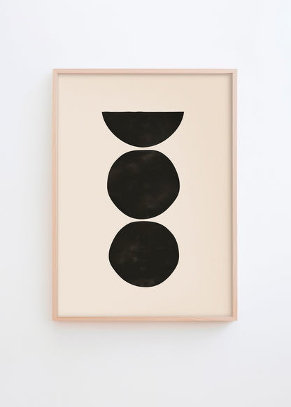Minimalist poster with three stacked black shapes on a light beige background in a wooden frame.