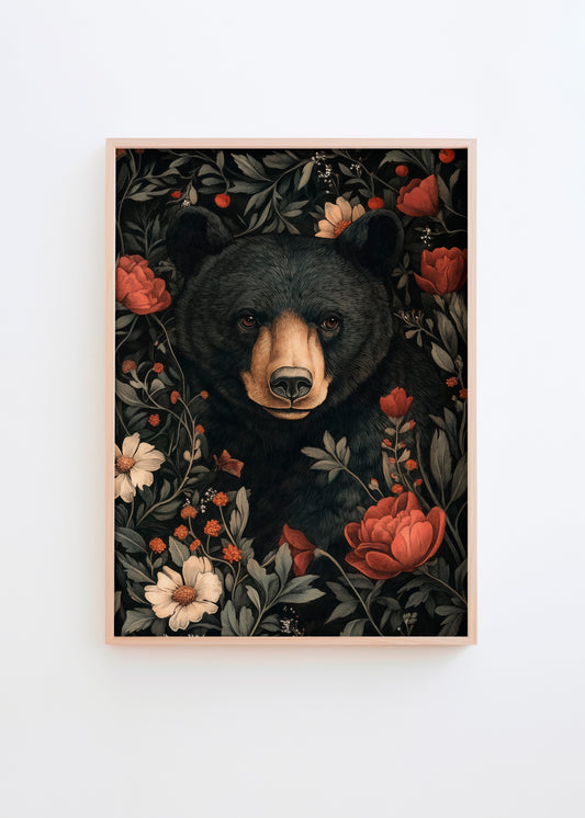 Framed poster featuring a calm black bear surrounded by red and white wildflowers and dark green foliage, against a deep, moody background.