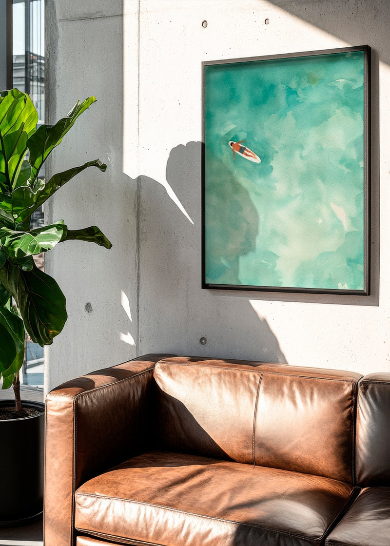 'Chill' poster in a modern living room setting, featuring a serene water-inspired design with soft green tones. The artwork adds a calming and refreshing touch, perfectly paired with a leather sofa and natural light for a contemporary, relaxed atmosphere.