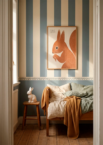 Happy Squirrel Illustration art poster by Ohkimiko displayed above a wooden bed in a cosy children’s bedroom with blue and cream striped walls, soft bedding and warm natural details.