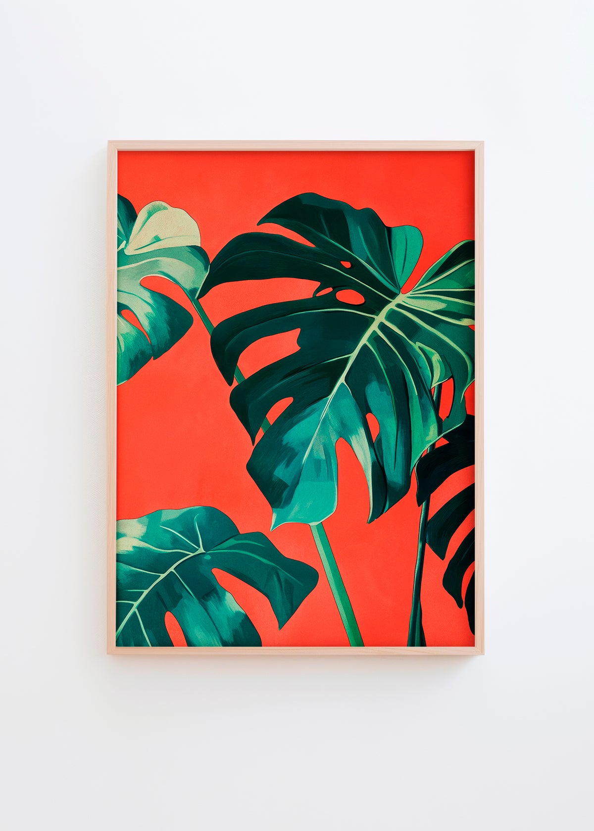 Botanical poster featuring green monstera leaves on a vibrant red-orange background in a light wood frame.