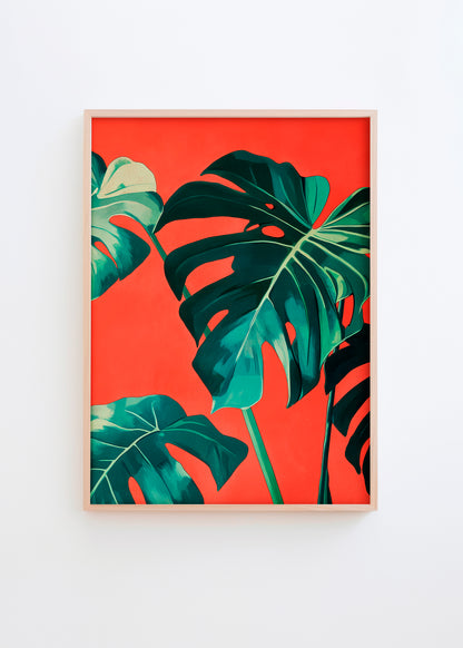 Botanical poster featuring green monstera leaves on a vibrant red-orange background in a light wood frame.