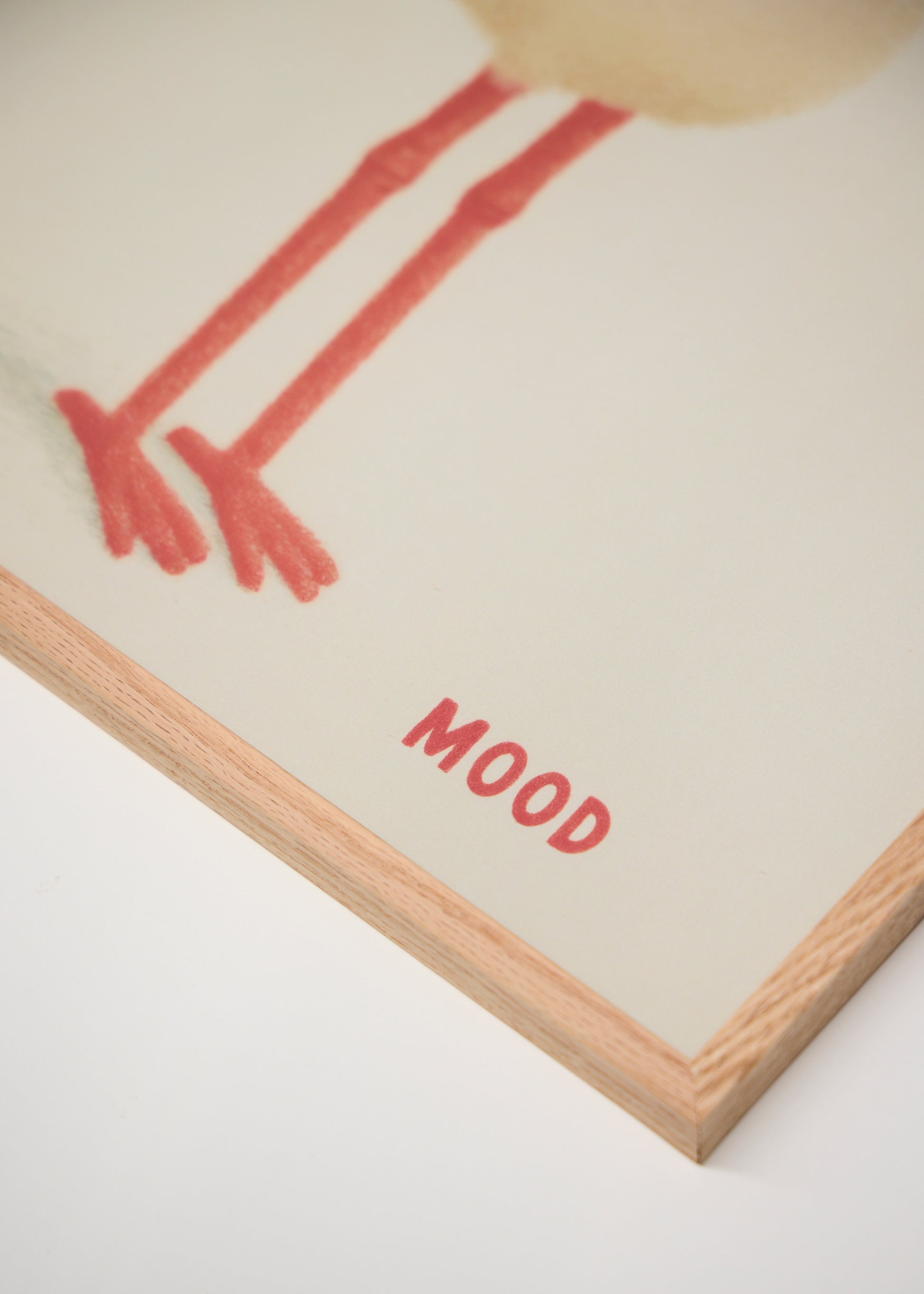 Close-up of the Mood poster featuring red bird legs and the word "MOOD" in bold red letters, shown with a light oak frame.