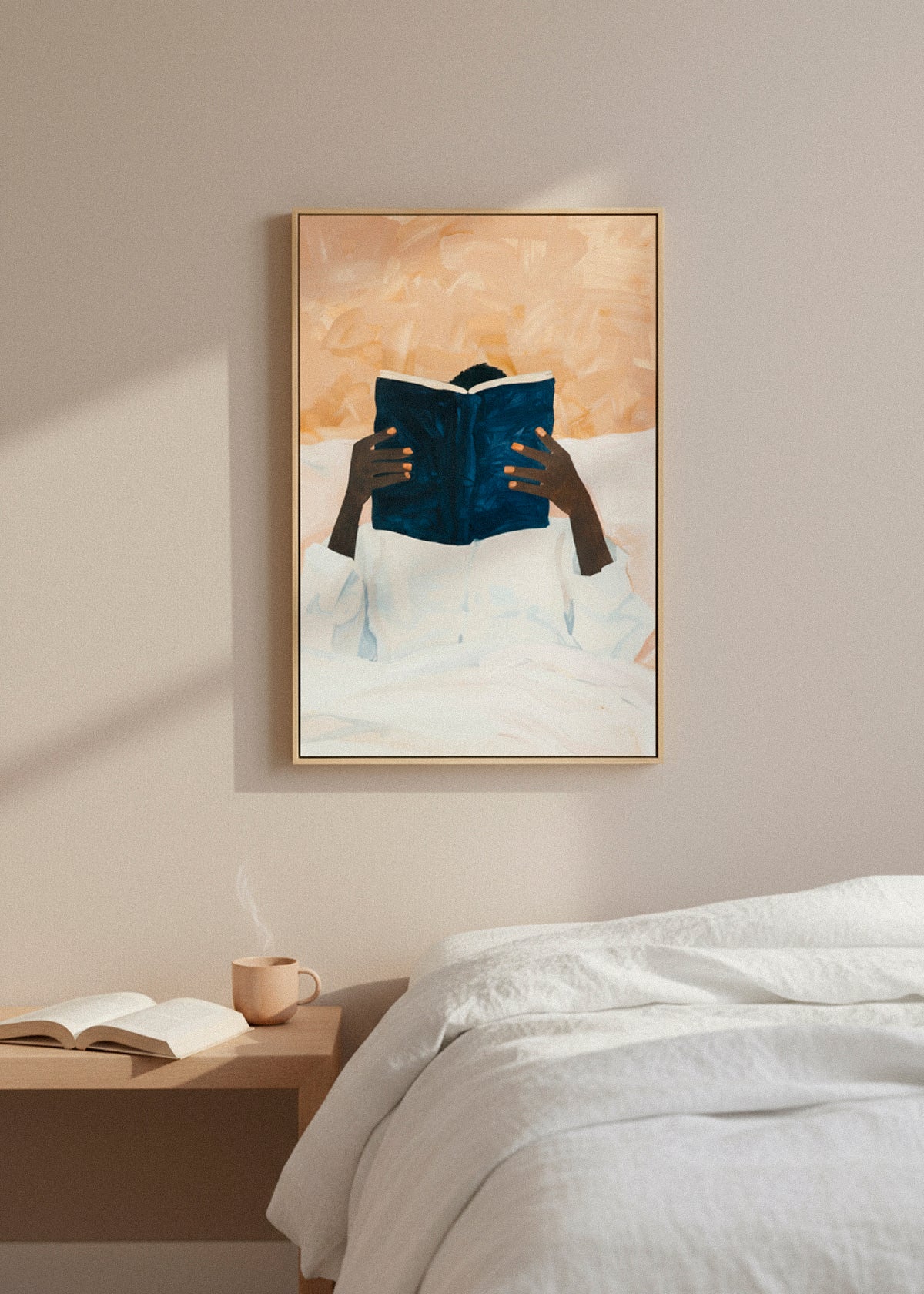 “Must Read” canvas print featuring a person reading in bed, surrounded by soft beige tones and morning light.