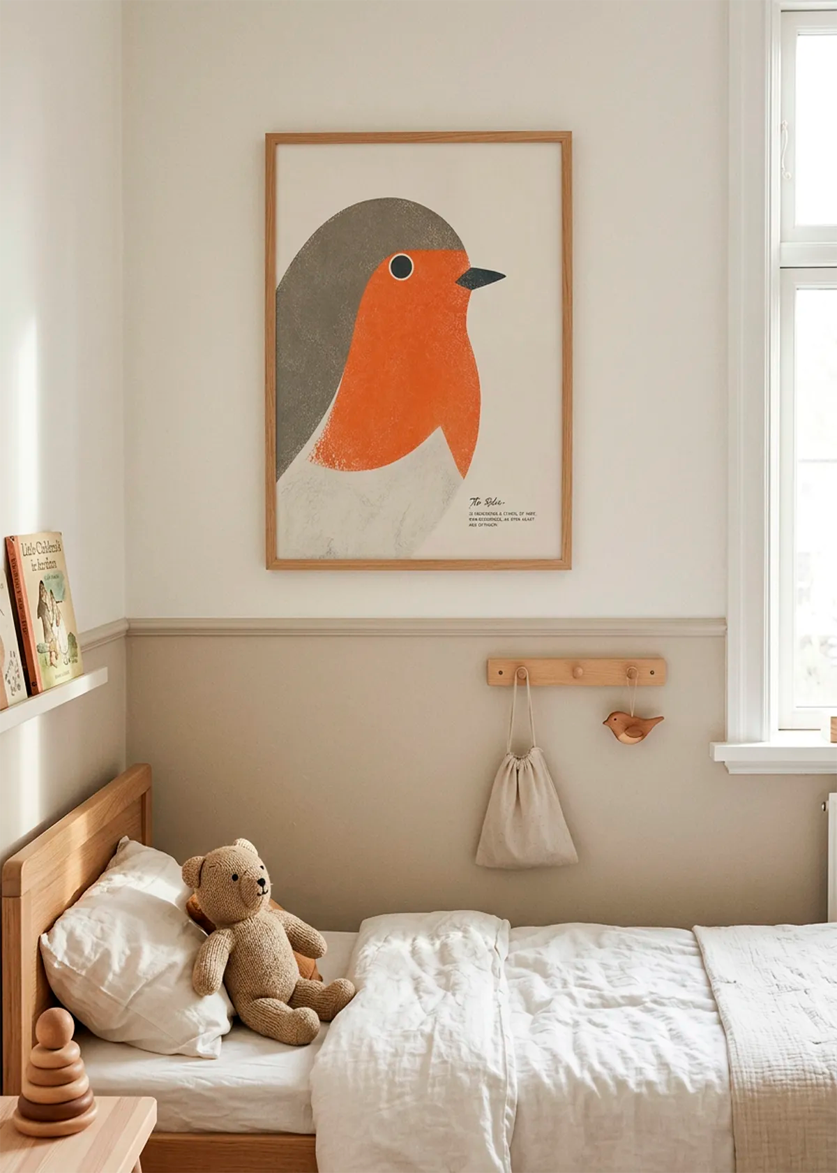 Red Robin New Beginnings art poster by Ohkimiko displayed in a calm children’s bedroom with natural wood furniture, soft beige tones, white bedding and warm daylight.