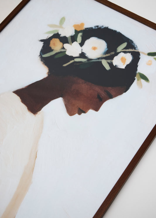 Close-up of Saint poster in soft sunlight, artistic female form with pink and neutral hues, elegant decor piece.