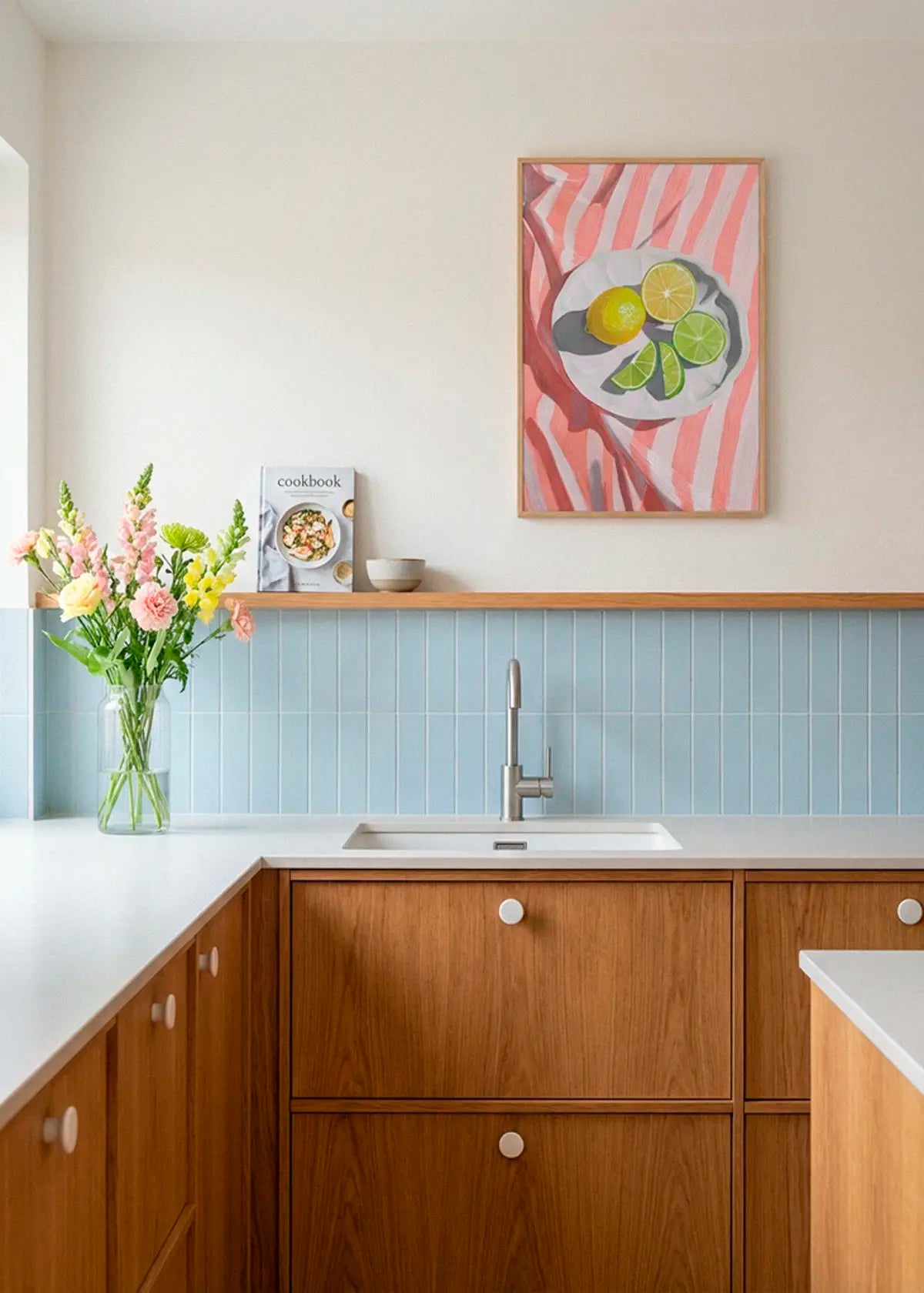 Slice of Lemon poster styled above the sink in a bright Scandinavian kitchen environment