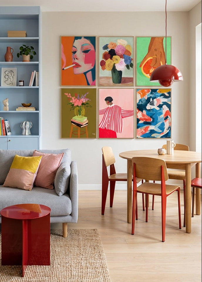 Colorful Hello Poster gallery wall featuring Smoke, Blossoms, Fruit Lover, Floral Vase, Red Stripes and Koi posters styled in a bright Scandinavian living and dining room with soft blue shelving, oak table and modern decor.