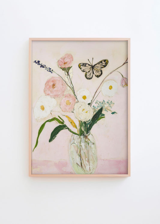 Summer Jar floral poster in a natural oak frame featuring a glass vase with soft white and blush pink flowers, a butterfly, and botanical details, styled on a white wall in a bright Scandinavian interior by Hello Poster