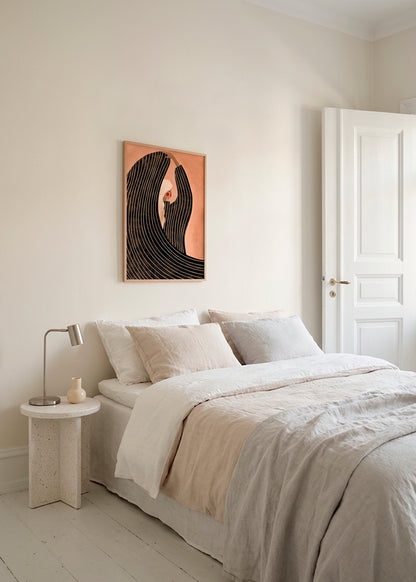 Minimalist bedroom interior with “The Woman With the Black Dress” art print by Bea Müller above the bed, featuring a stylized female figure in black flowing lines on a soft peach background, creating a calm and elegant atmosphere.