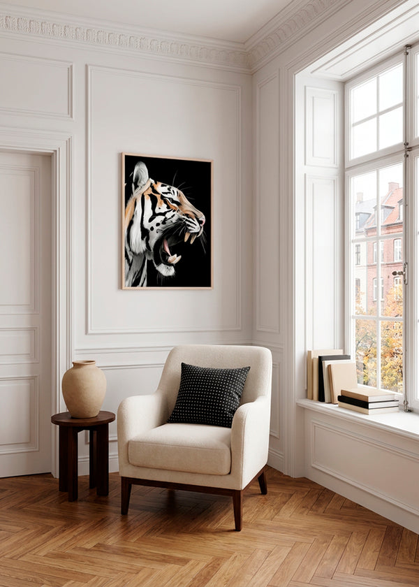 Tiger art print with black background hanging in an elegant living room, creating a bold contrast in a bright Scandinavian interior.