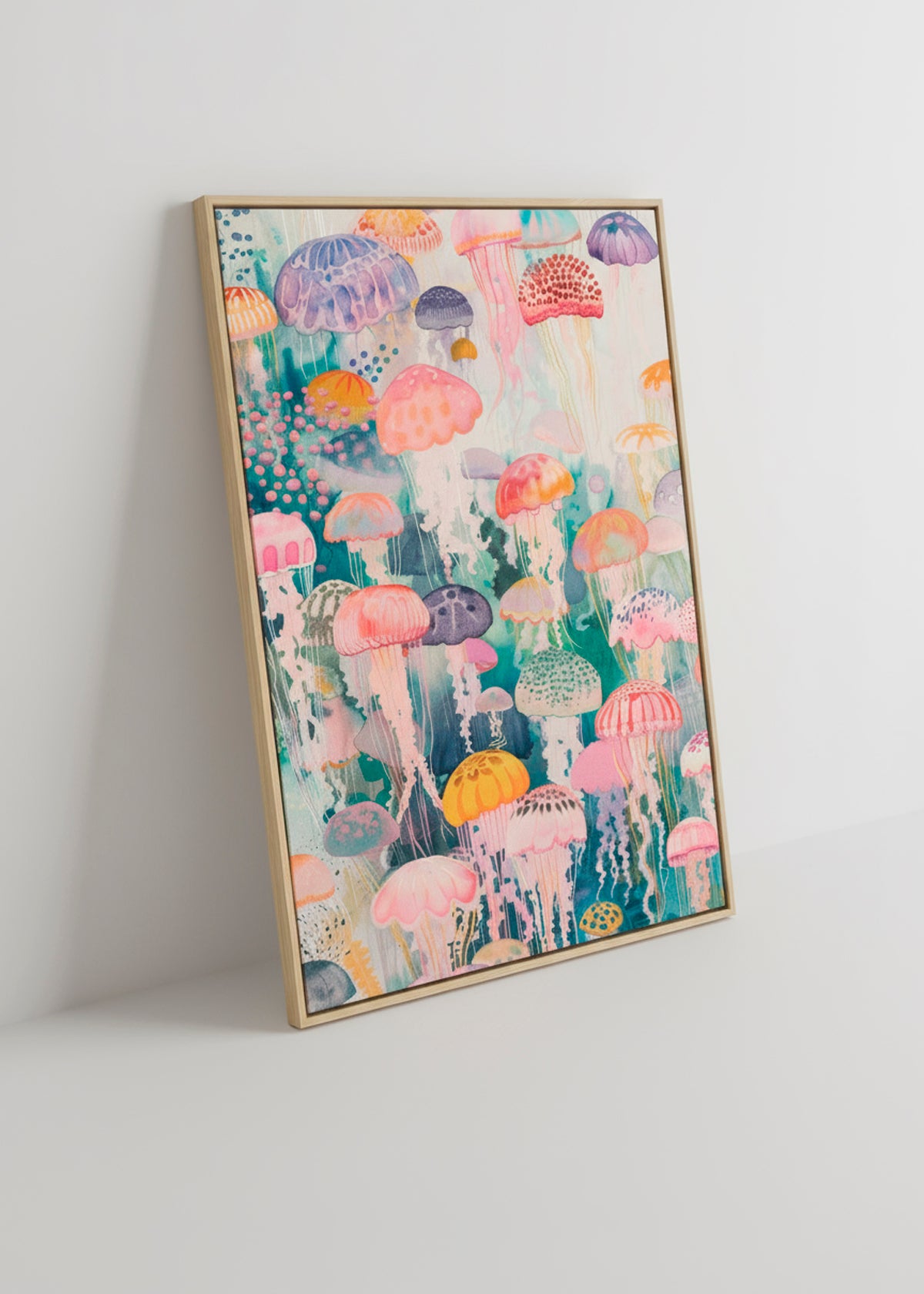 Framed canvas print featuring vibrant jellyfish leaning against a white wall with soft shadows.