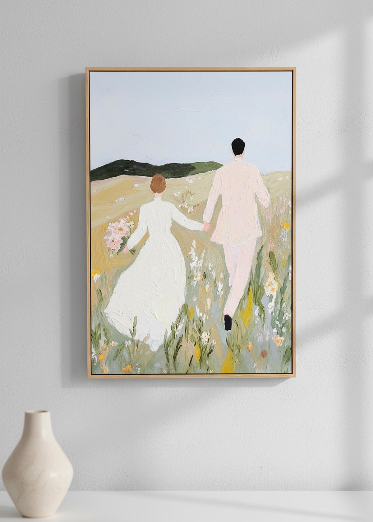 Close-up of the “Us” canvas print showing the couple walking through a field.