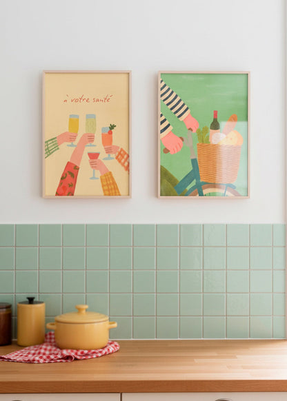 Kitchen wall with mint green tiles featuring the “À votre santé” and “French Picnic” posters in oak frames.