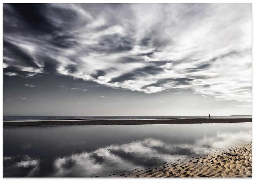 Lone Walker on Reflective Beach – B2B