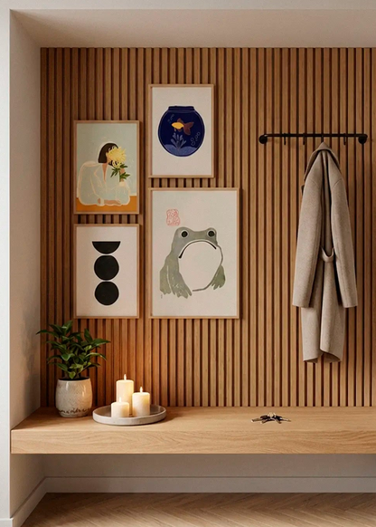 The Chrysanthemum, Fishy, Boulder and Grumpy Frog posters styled as a gallery wall in a Scandinavian entryway