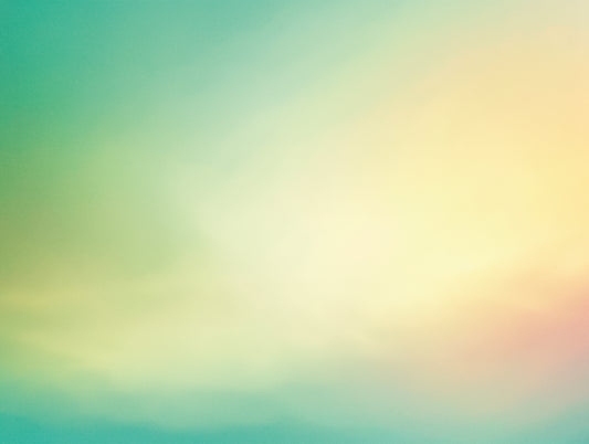 Close-up of a turquoise to yellow gradient design with soft color blending and pastel tones.